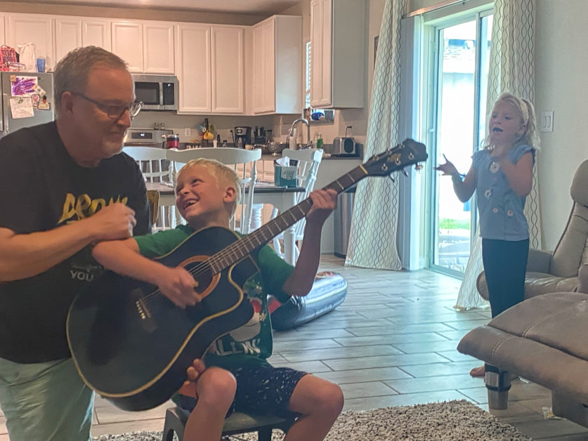 Not a technically great photo but I love the look on Noah's face and Madi clapping for him.