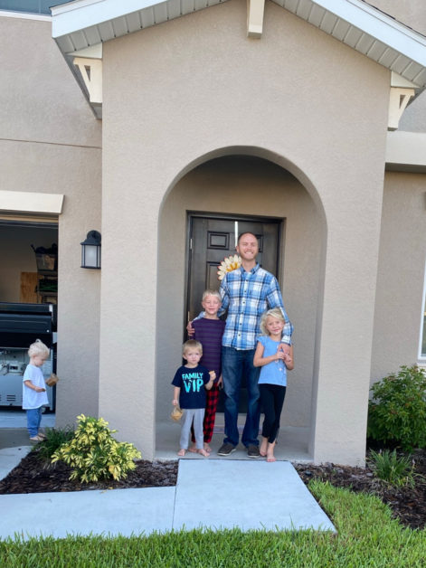 We tried to get a picture in the front of the house but Andrew didn't want to step on the little stones by the bush.