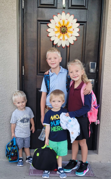 I LOVE this photo. Meagan took it on their first day of school. She is also teaching this year at Andrew and Grayson's preschool so it is a whole family affair.